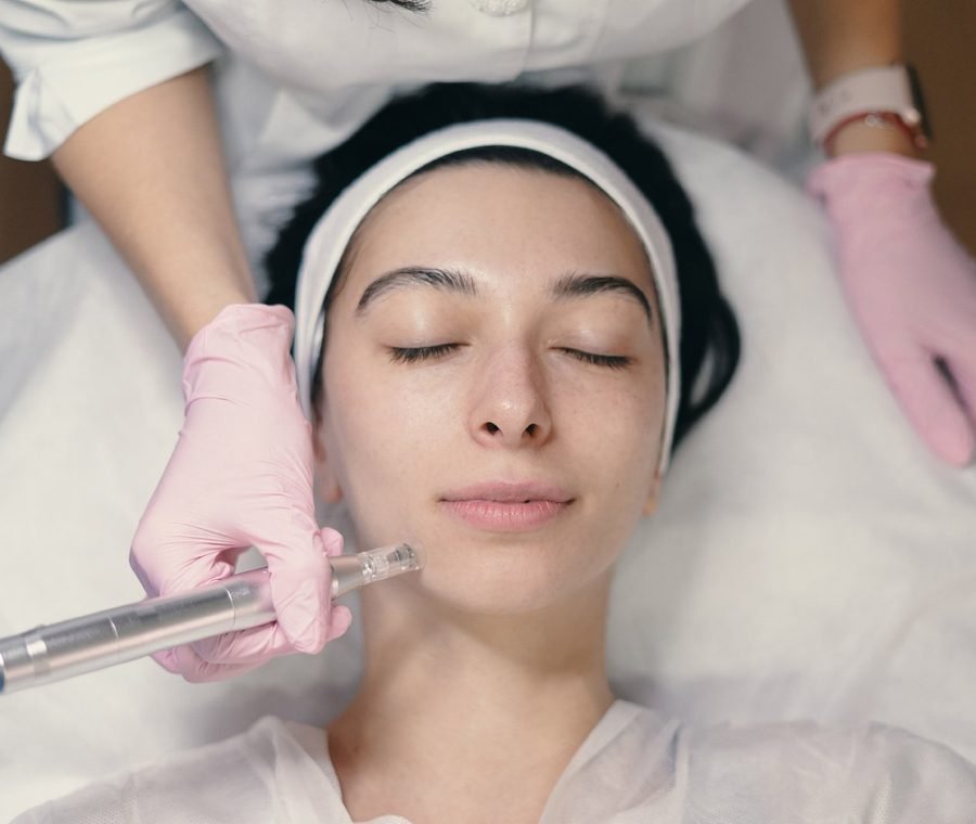 Aesthetic specialist performing a facial treatment at Diva Healthcare Clinic